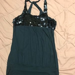 Black shirt with sequin at the top.